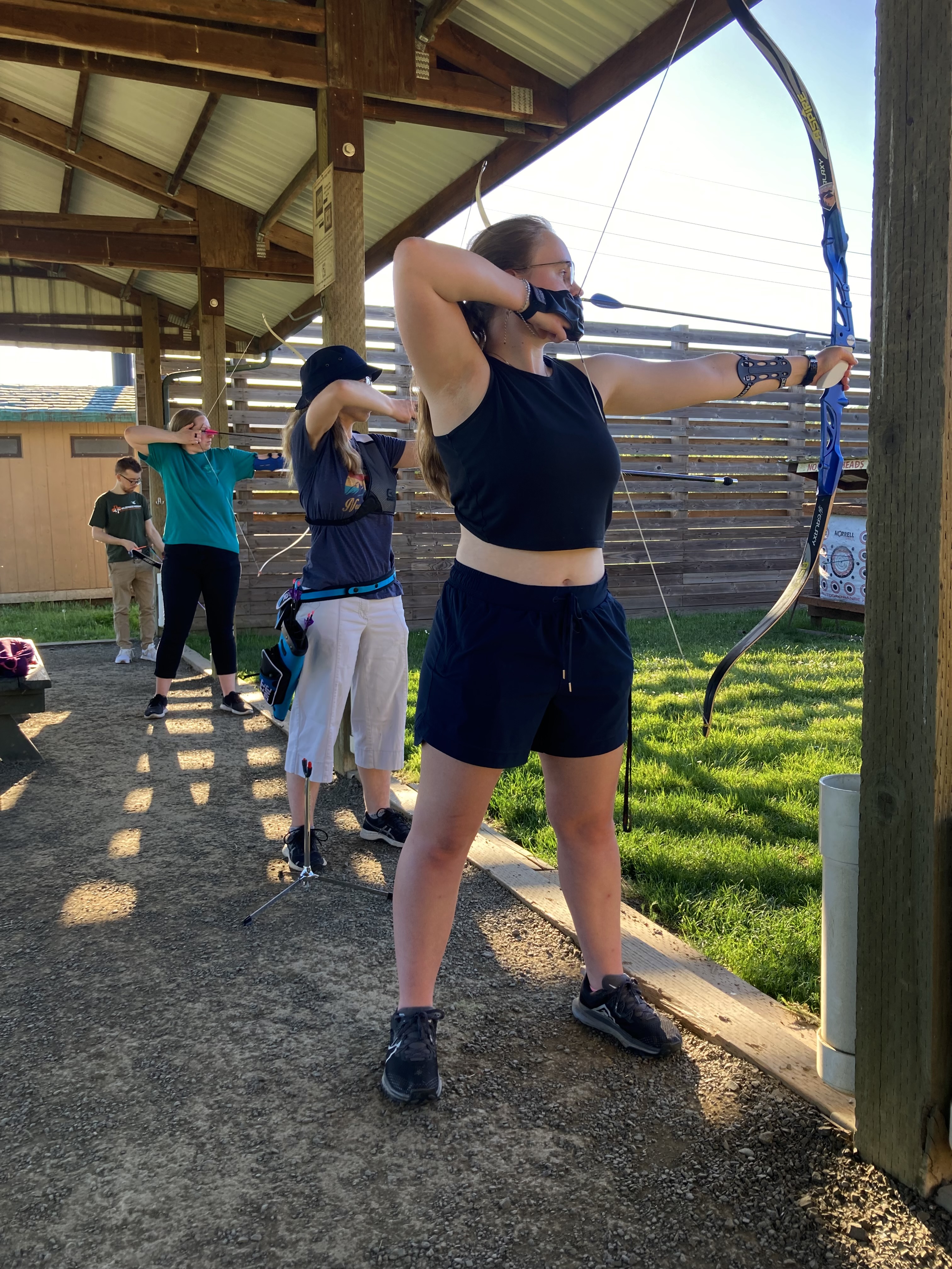 archery club members shooting at EE Wilson