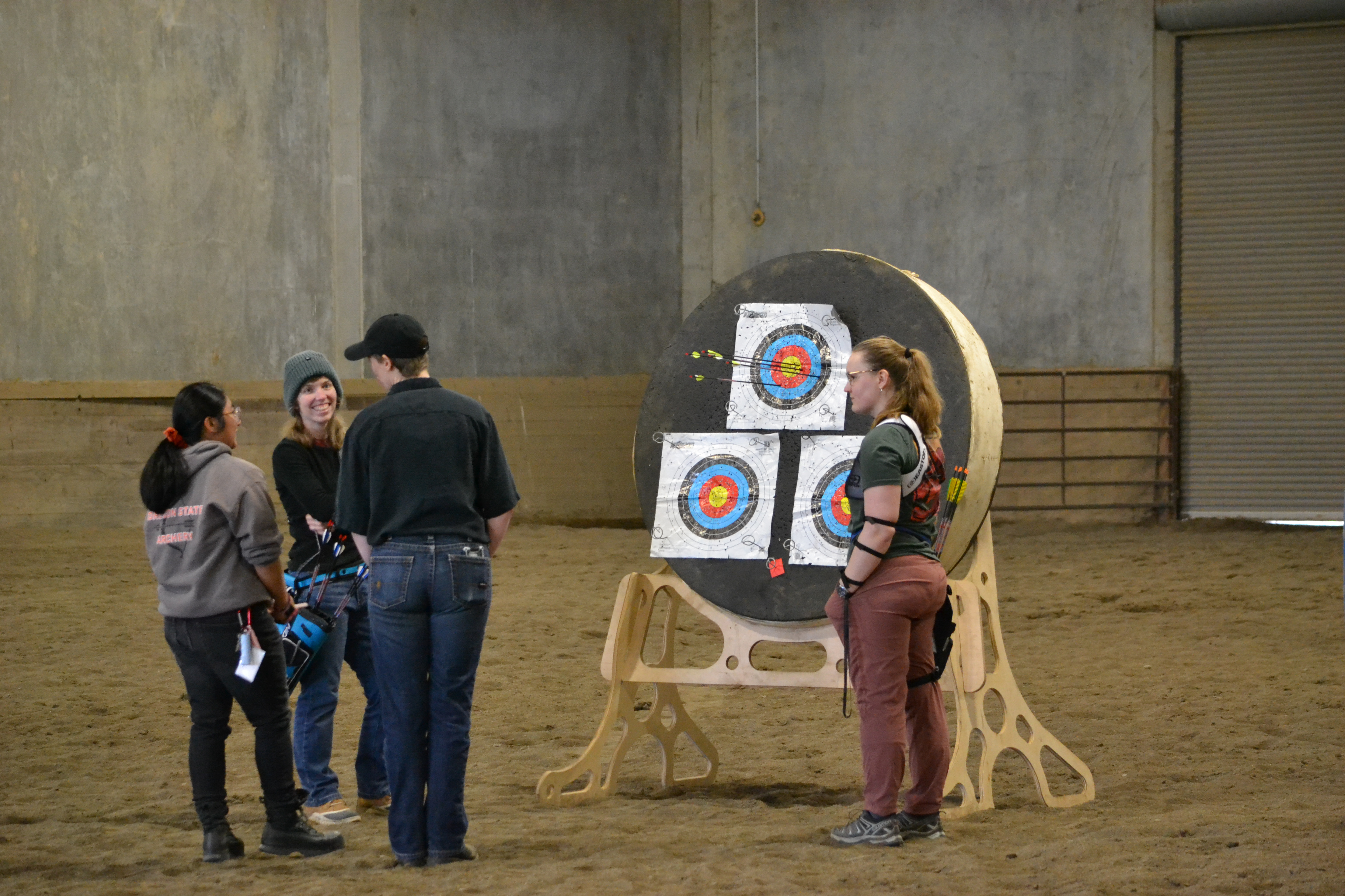 archery club members standing around target